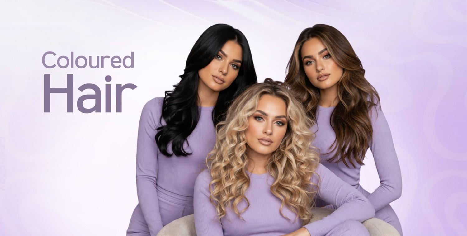 Three women with vibrant black, blonde, and brown coloured hair in matching lavender outfits.