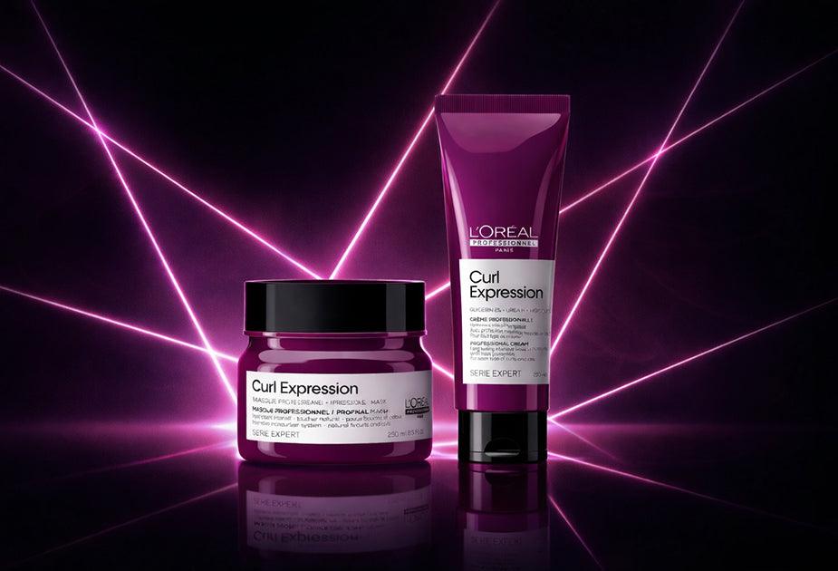 L'Oreal Curl Expression hair care products on a dark background with purple lighting