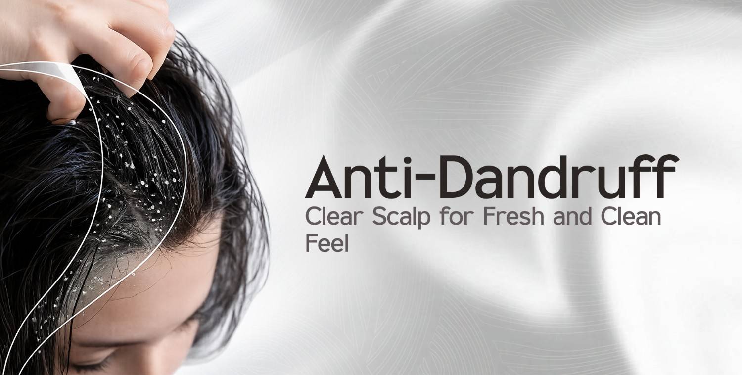 Close-up of a person's dark hair with visible dandruff flakes, highlighting the need for anti-dandruff solutions.