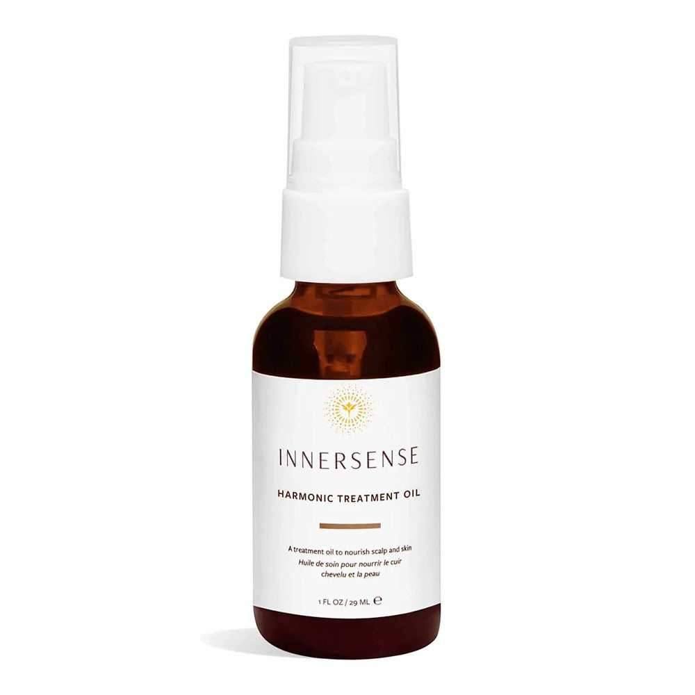 Innersense Harmonic Treatment Oil in a small, amber glass bottle with a white pump dispenser.