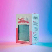Curly Girl Movement Curly Hair Towel in its white and pink box, showing a peek of the light blue, textured towel.