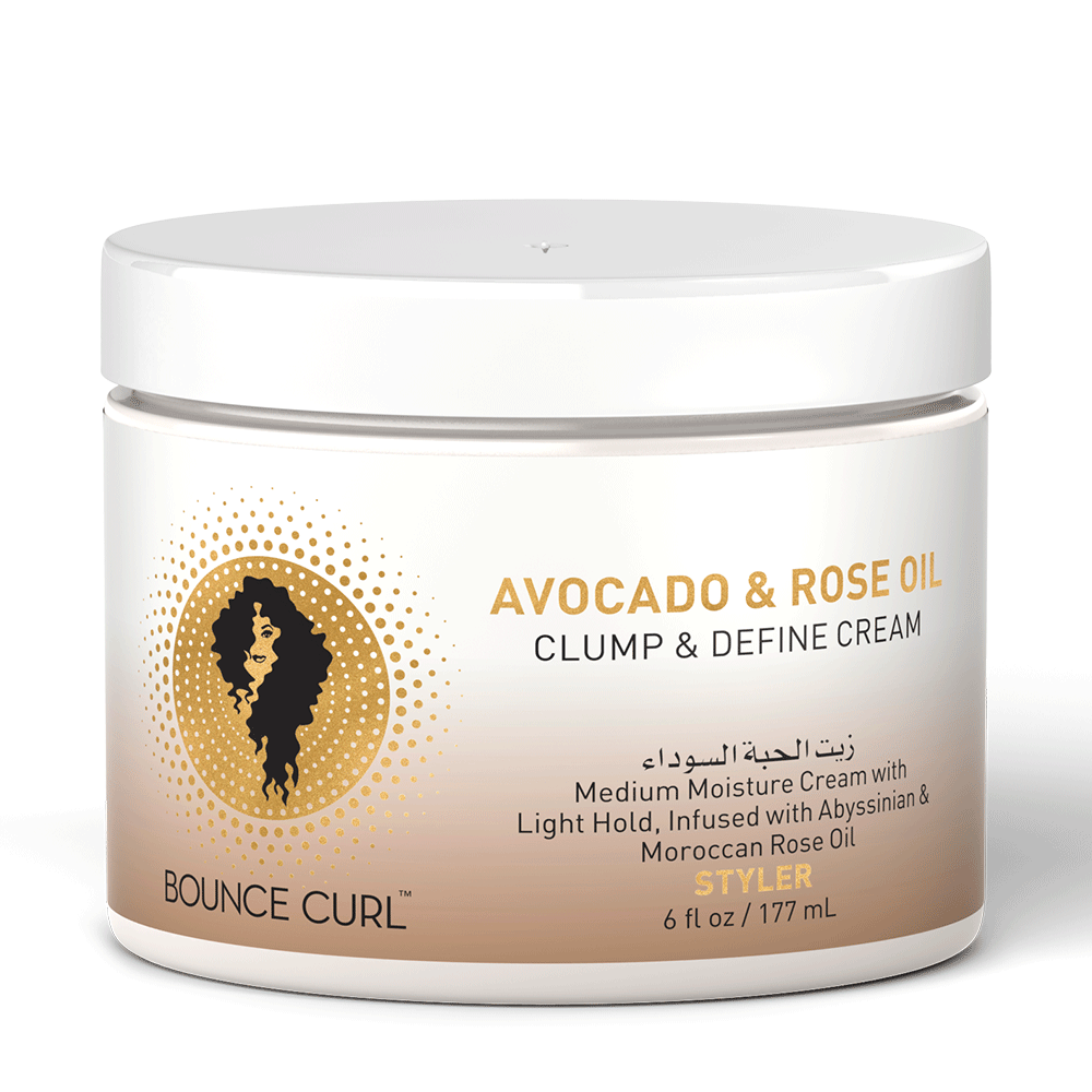White jar of Bounce Curl Avocado & Rose Oil Clump & Define Cream, 6 fl oz, with gold text and a curly hair logo.