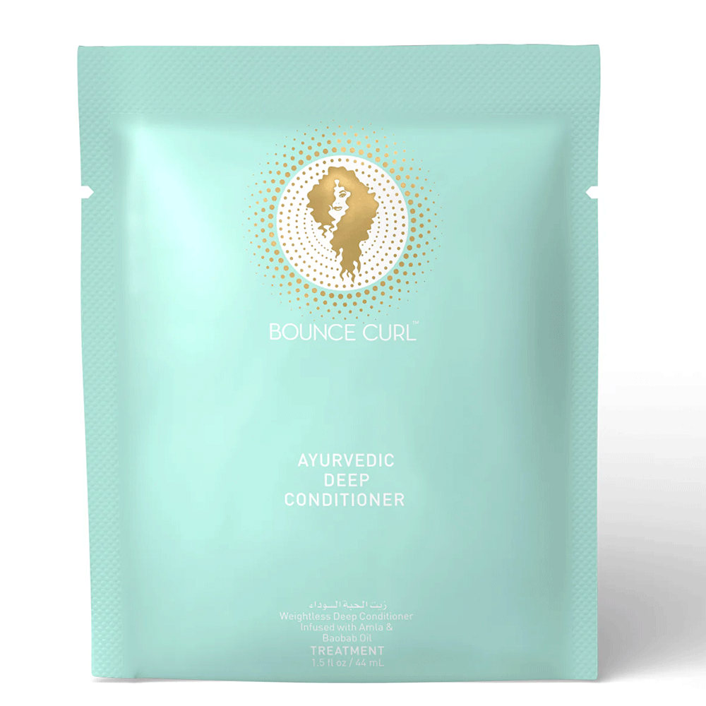 Light teal Bounce Curl Ayurvedic Deep Conditioner pouch with gold logo and product details.
