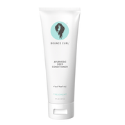 White Bounce Curl Ayurvedic Deep Conditioner tube with a teal logo and black text, 8 fl oz.