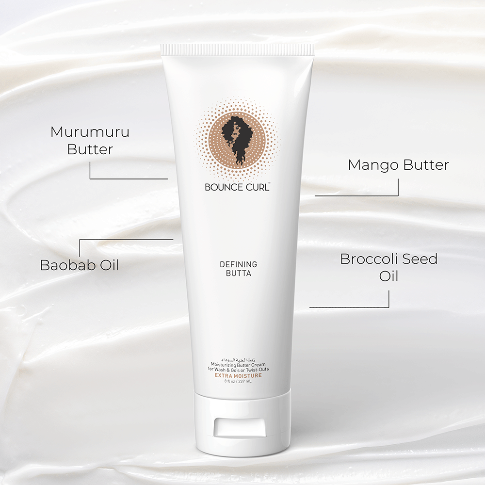 White Bounce Curl Defining Butta tube with brown logo, highlighting Murumuru, Mango, Baobab, and Broccoli Seed oils.