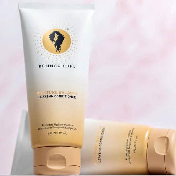 Bounce Curl Moisture Balance Leave-In Conditioner, white and gold tube, 177ml, with a curl logo.