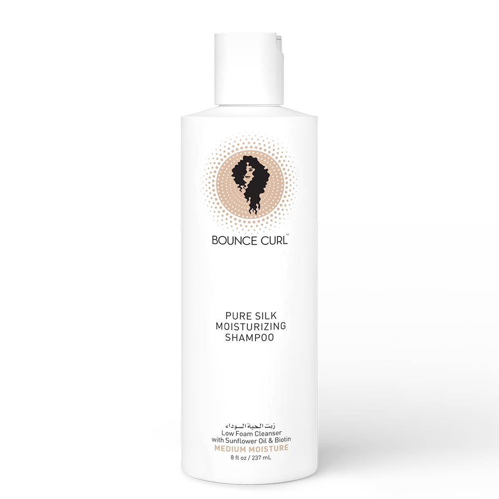 White Bounce Curl Pure Silk Moisturizing Shampoo bottle with a flip-top cap and curly hair logo.