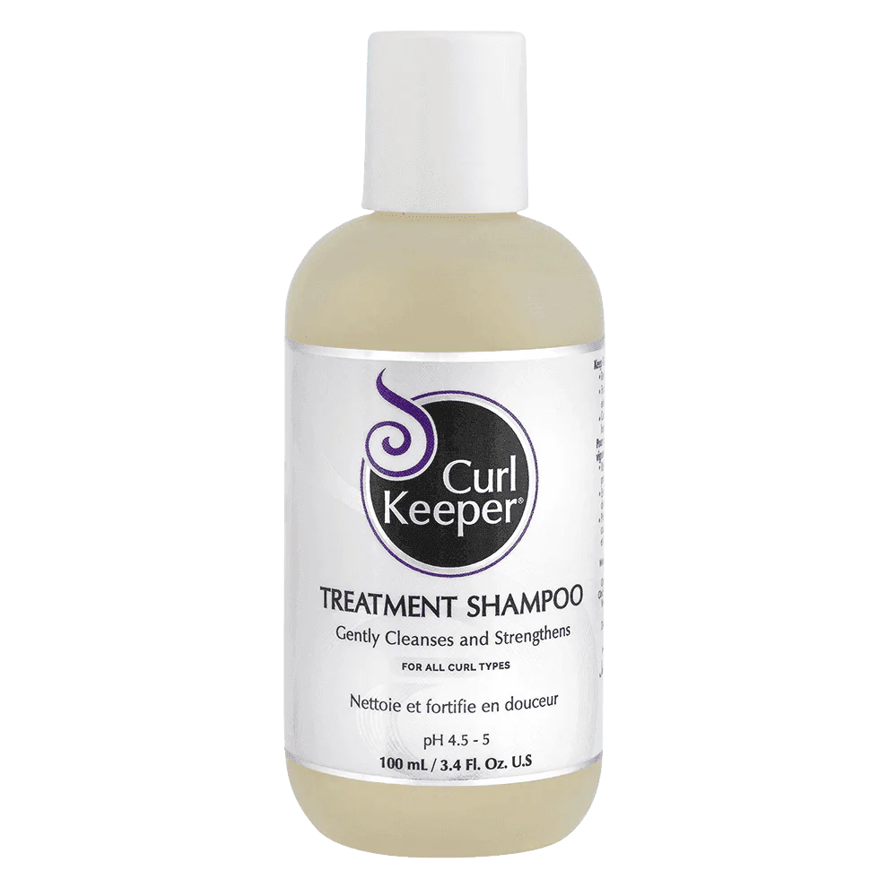 Curl Keeper Treatment Shampoo, 100ml bottle with white cap and purple/white label, for all curl types.