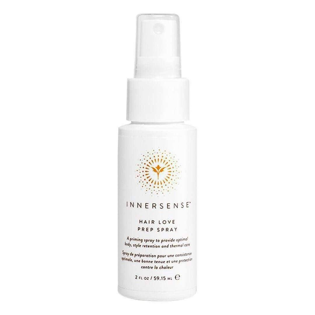 White Innersense Hair Love Prep Spray bottle with gold sunburst logo and black text.