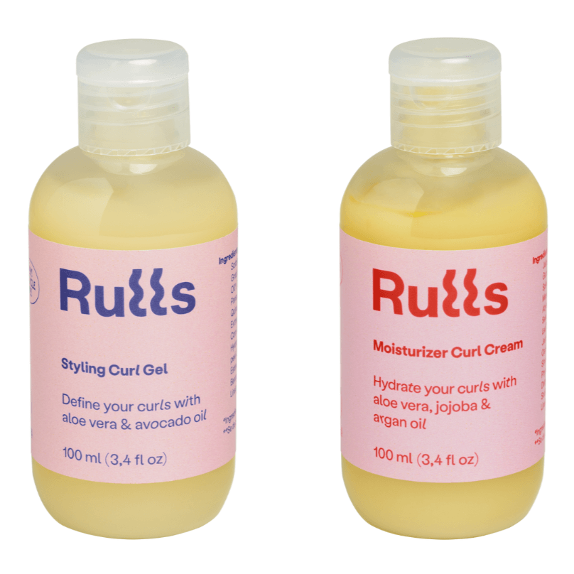 Two Rulls mini bottles, a yellow Styling Curl Gel and Moisturizer Curl Cream, with pink labels.