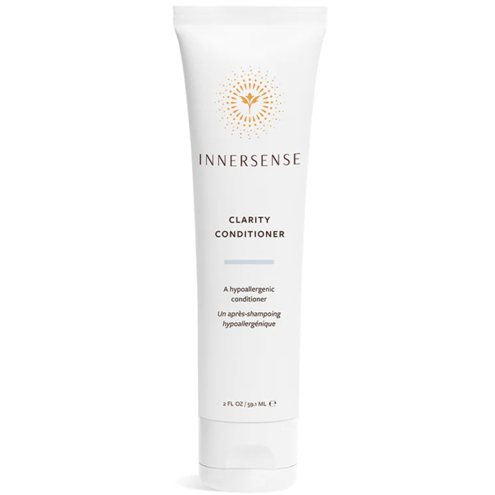 White Innersense Clarity Conditioner tube, 2 fl oz, with orange sunburst logo and text.