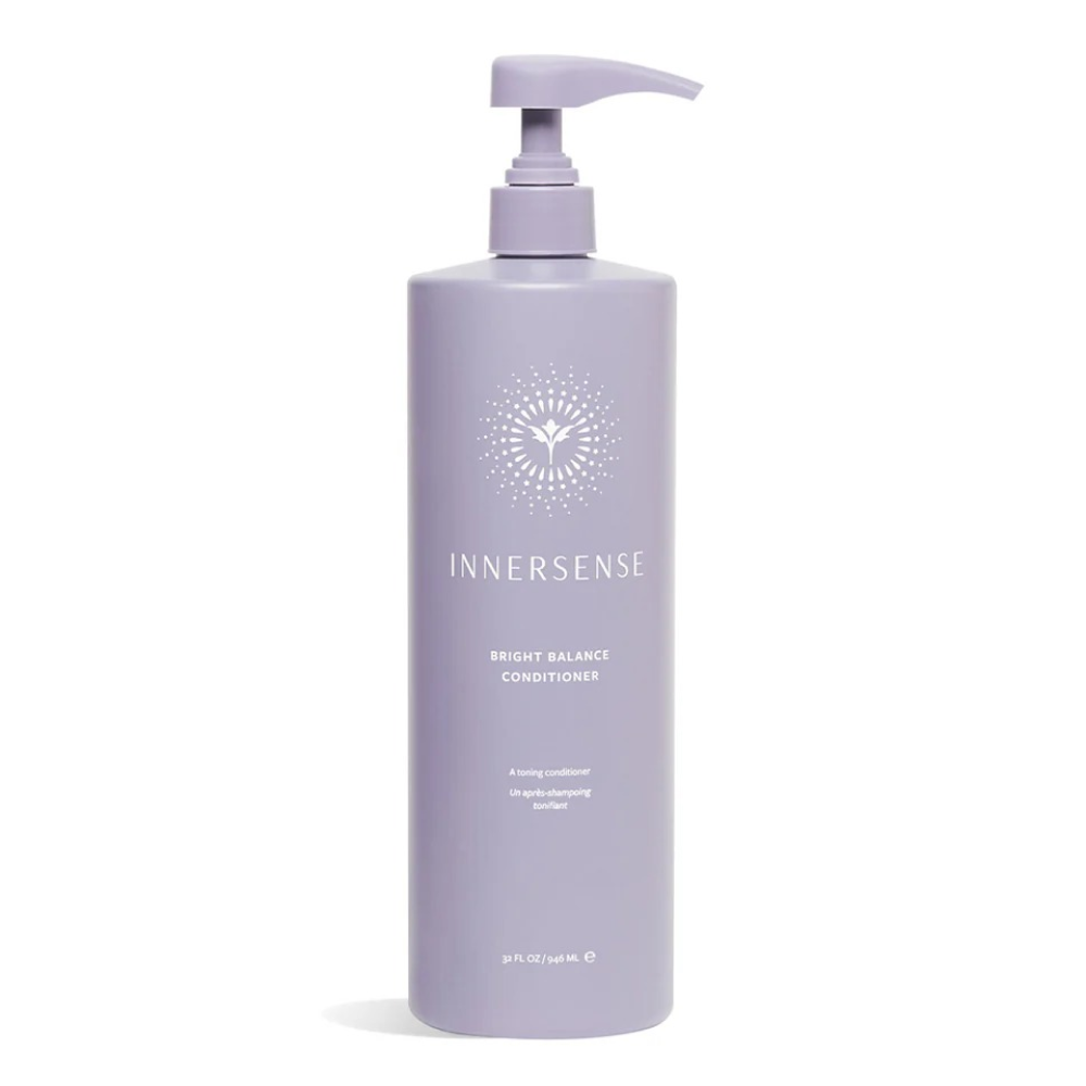 Large lavender Innersense Bright Balance Conditioner pump bottle with white logo and text.